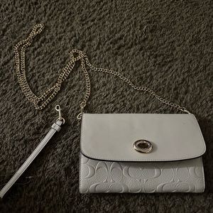 White purse with hand strap